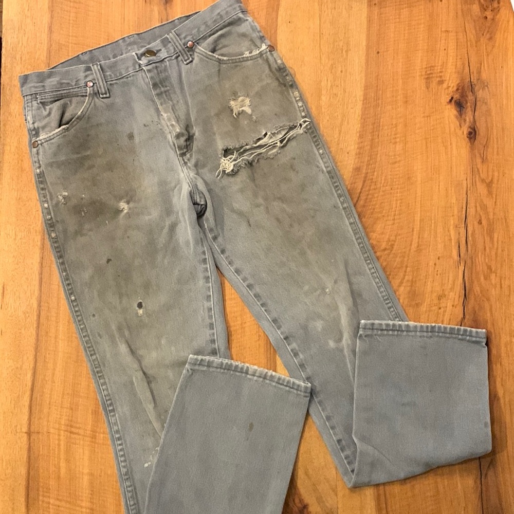 Distressed destroyed workwear wrangler jeans